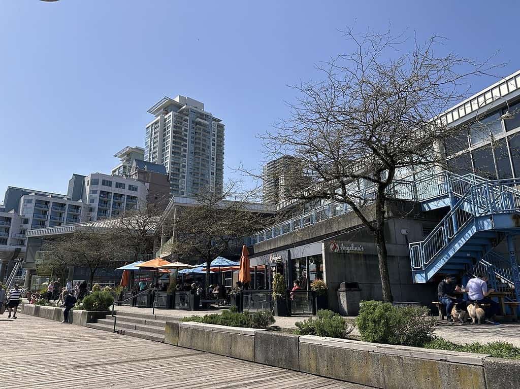Boardwalk scene at River Market with colorful umbrellas, cafés, and modern condos rising in the background. Adds a lively waterfront atmosphere that's perfect for walking, eating, and people-watching.