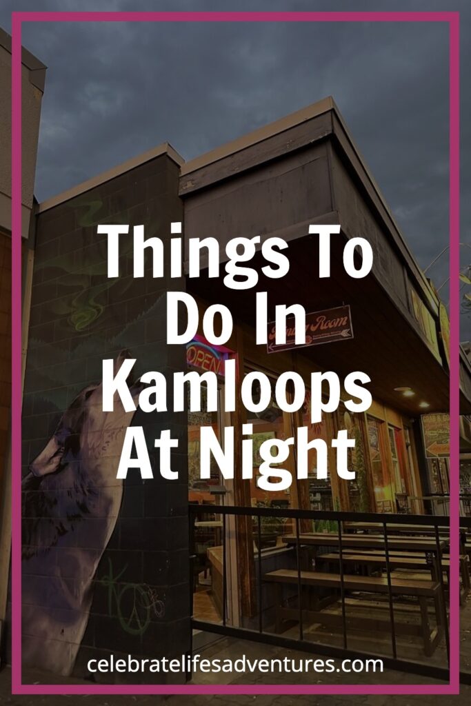 Outdoor view of a downtown Kamloops restaurant at dusk, with a glowing "open" sign and a purple-toned mural of a howling wolf. Captures local flavor and easy night outings in Kamloops.
