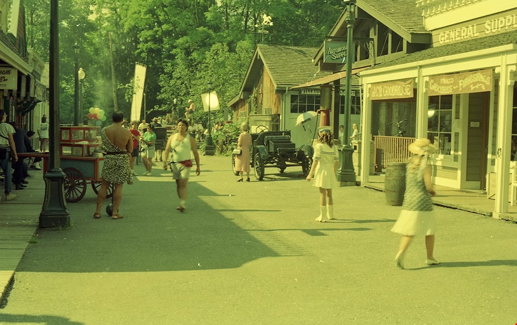Photograph of film crew and actors during the filming of the Stephen King horror movie "IT" starring Tim Currie. The filming took place at Burnaby Village Museum.
