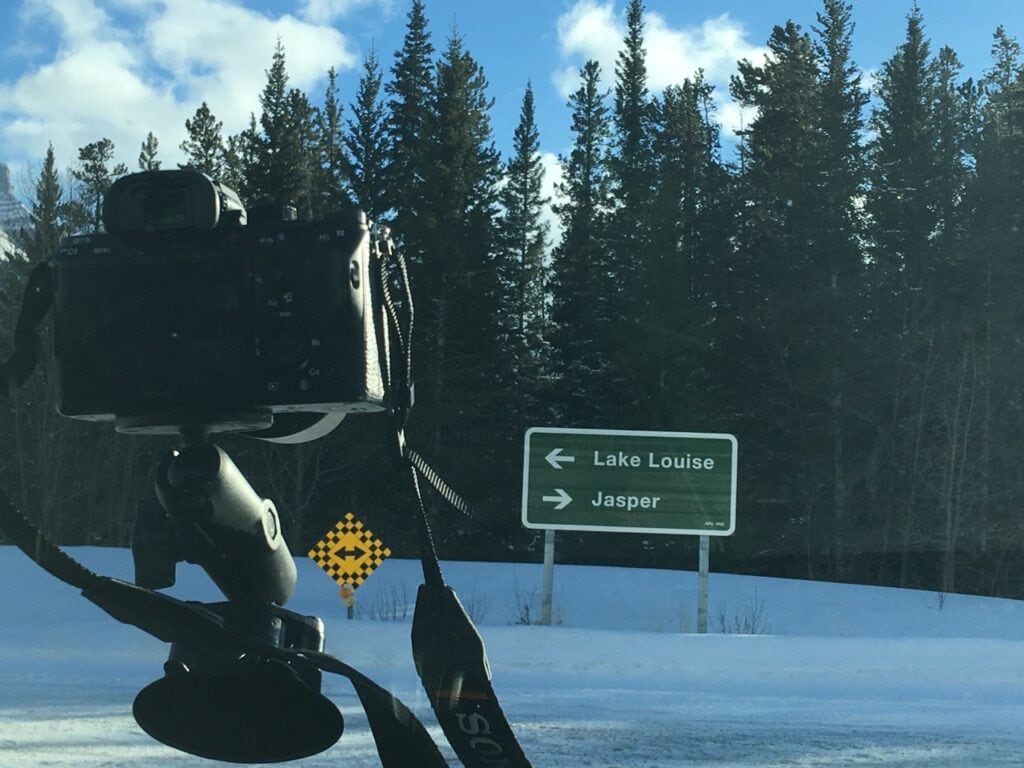Car view of mileage marker  - Road to Jasper, AB